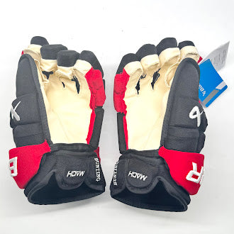 Bauer Supreme Mach - Gants de hockey NHL Pro Stock - Michael Bunting (noir/rouge)